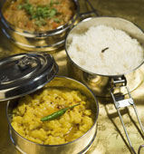 Tiffin = a stainless steel container with curries, rotis, rice, meat, dessert... MMMM